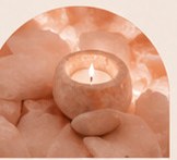 Hands holding glowing candle